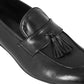 Elegant men's loafer in soft black leather with tassels